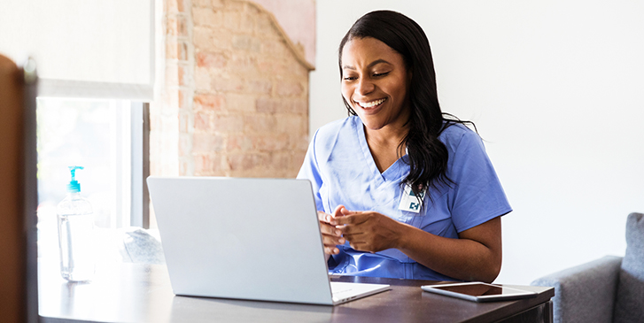 Health coach makes a computer call to a Medicare patient.