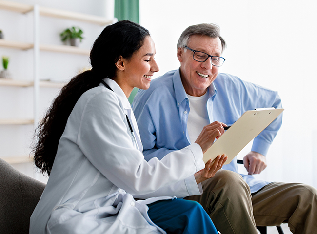 A person is working at a computer in a busy office.