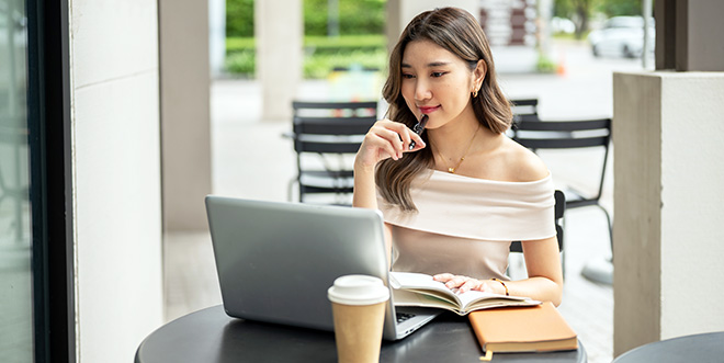 Woman Shops For A Personal Choice EPO Catastrophic Plan On Her Computer