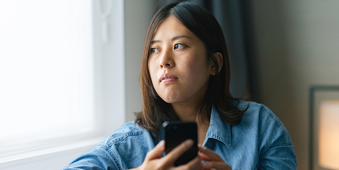 Woman staring out window