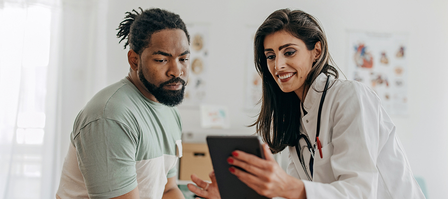 Doctor and patient talking in an exam room