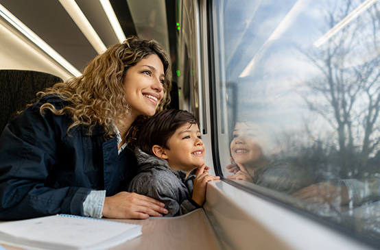 Smiling mother and son going on a trip