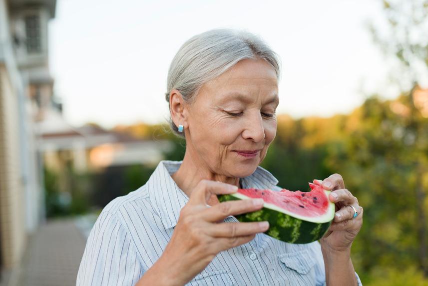 Woman eating watermelon.