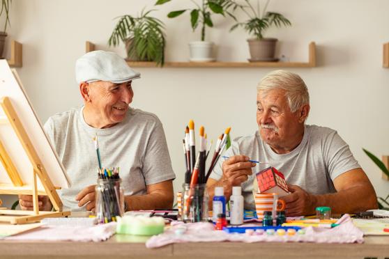Men painting together