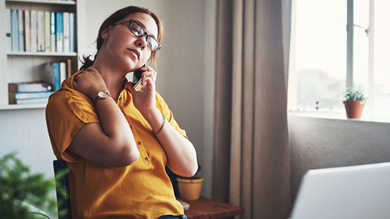 Woman On Phone Discussing The Emotional Toll Of COVID-19