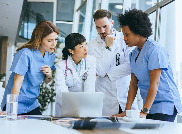 A group of physicians consulting on a case