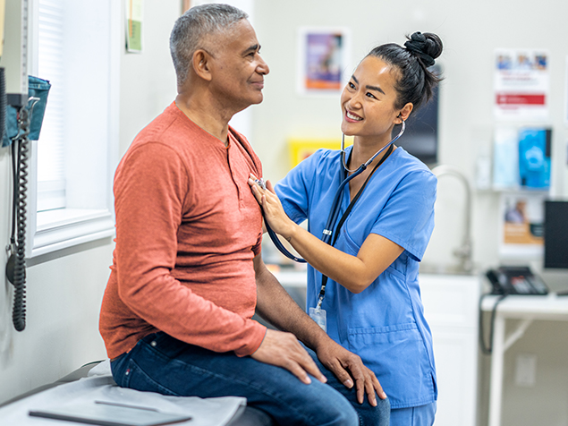 Pediatrician Examining A Child Covered By An IBX Health Plan